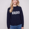 Navy sweater featuring 'amour' graphic with flecked yarn detail, perfect for cozy days by Charlie B.