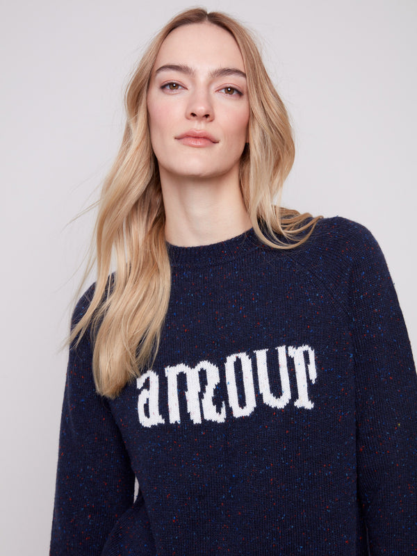 Stylish navy sweater with bold 'amour' graphic print and comfortable raglan sleeves by Charlie B.