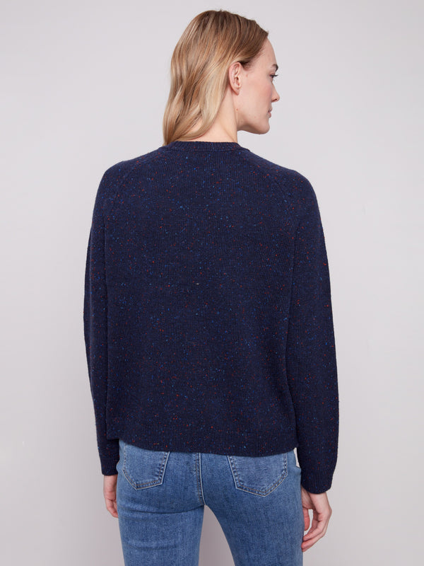Elegant flecked yarn adds texture to this heather navy sweater with a charming 'amour' motif by Charlie B.