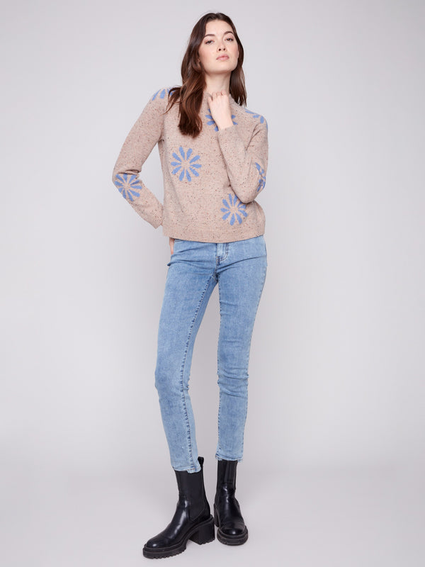 Nutmeg sweater with raglan sleeves and eye-catching blue floral designs, perfect for any season by Charlie B.