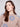 Stylish mock neck sweater in heather nutmeg with distinctive flecked yarn and blue floral pattern by Charlie B.