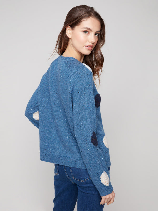 The raglan sleeves on this heather Oxford sweater complement its flecked yarn and playful polka dot pattern by Charlie B.