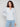 Denim-hued sweater with a notched neckline, crafted from soft eyelash yarn for a cozy feel by Charlie B.