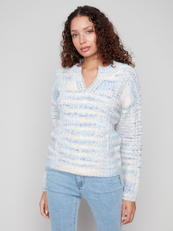 Eyelash yarn material gives this denim-toned sweater a plush texture, complete with notched neck by Charlie B.