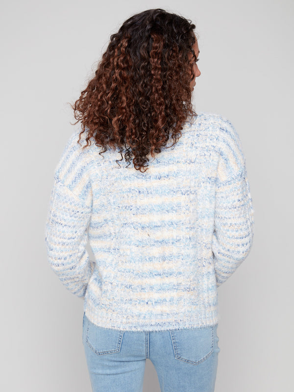Cable knit sweater in denim shade with unique drop shoulder design and subtle stripes by Charlie B.