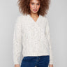 Ecru cable knit sweater with a notched neckline and drop shoulder design, perfect for a cozy look by Charlie B.