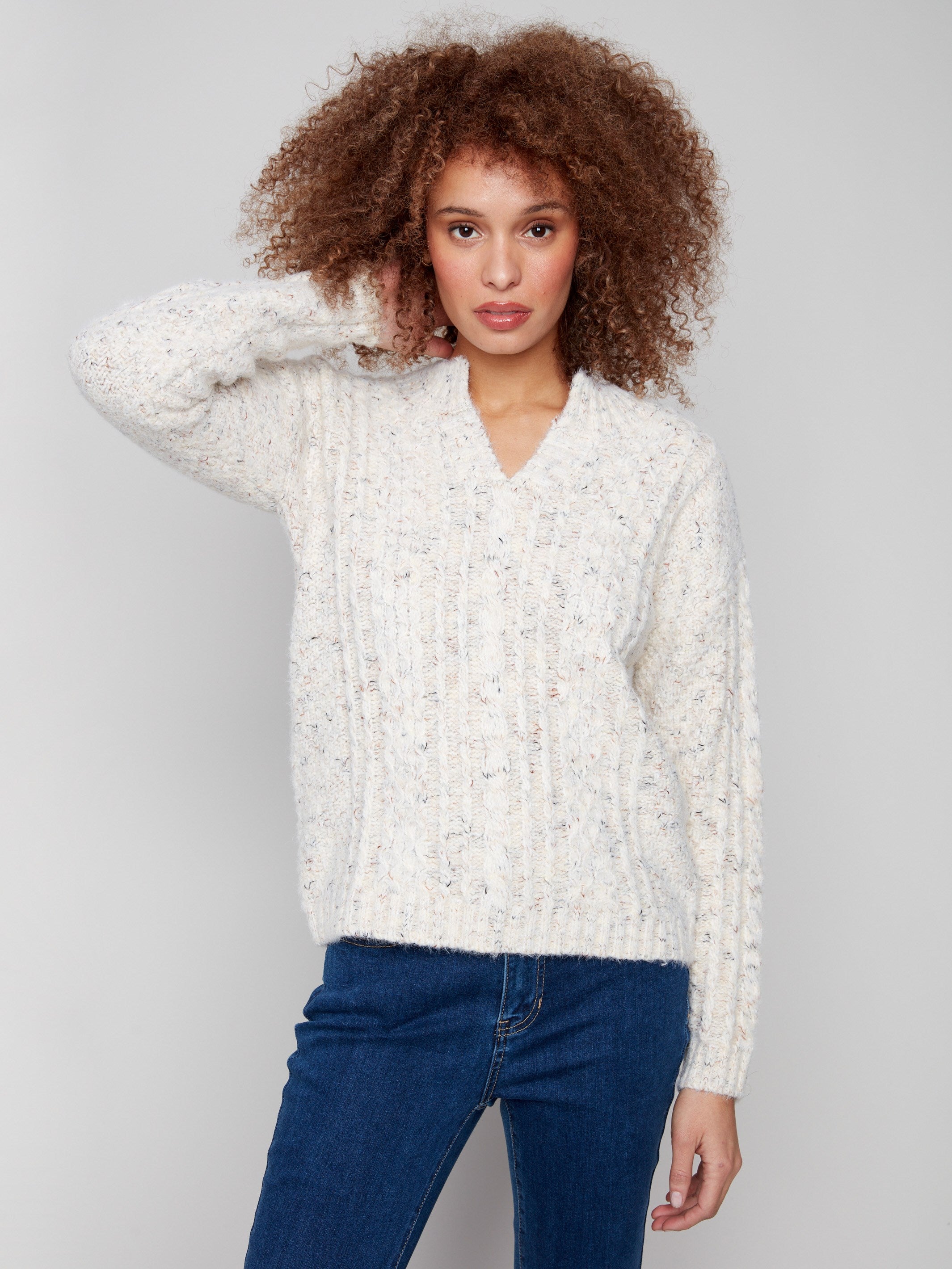 Stylish ecru sweater crafted from soft eyelash yarn material, featuring a unique striped pattern by Charlie B.