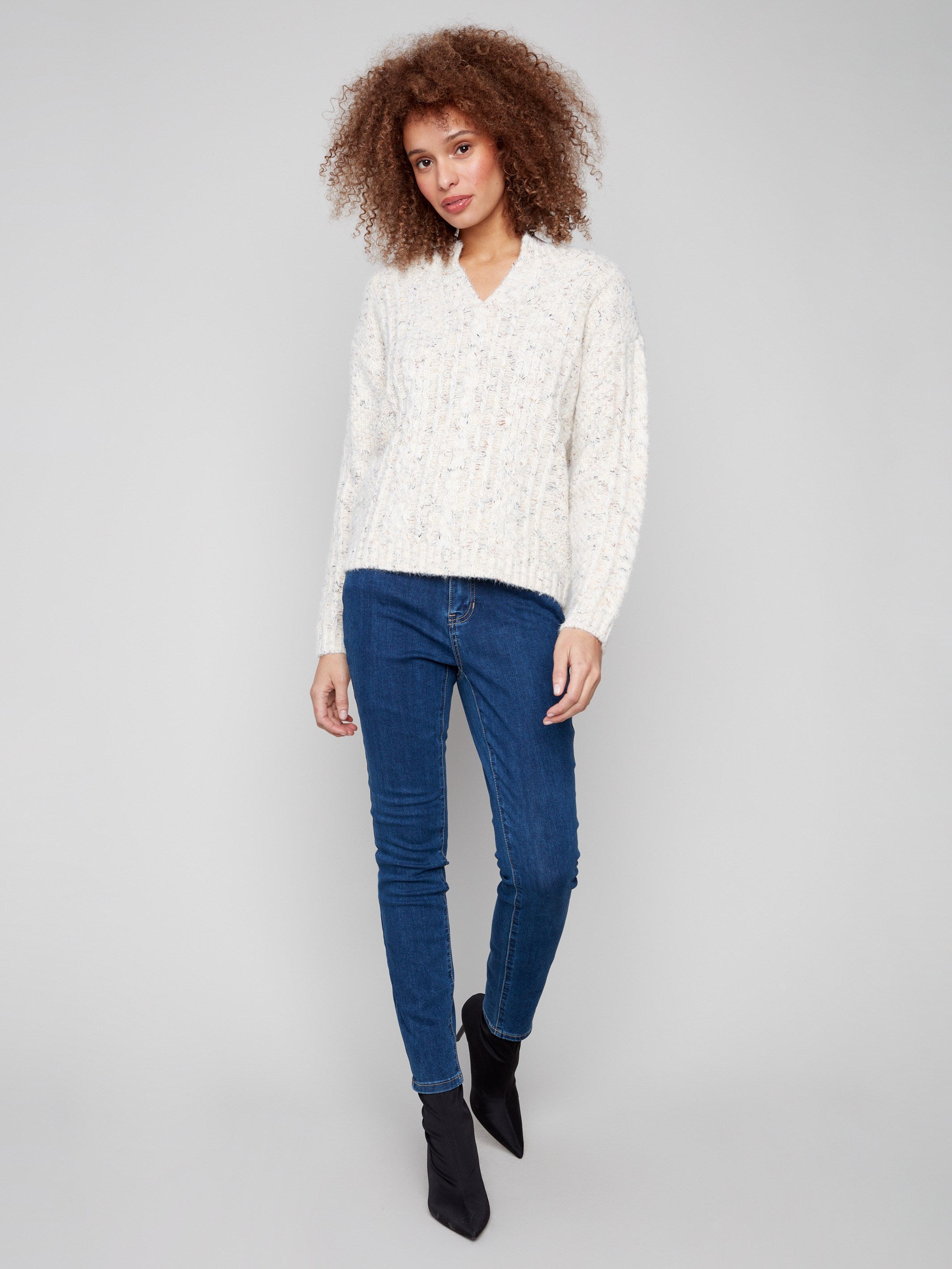 Chic ecru sweater with an elegant notched neckline and comfortable drop shoulder fit by Charlie B.