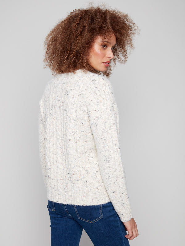Cozy cable knit sweater in ecru, made from luxurious eyelash yarn material for added warmth by Charlie B.