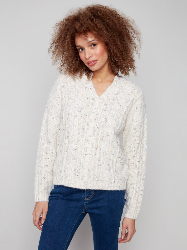 Fashionable ecru sweater showcasing a notched neck and exquisite drop shoulder design by Charlie B.