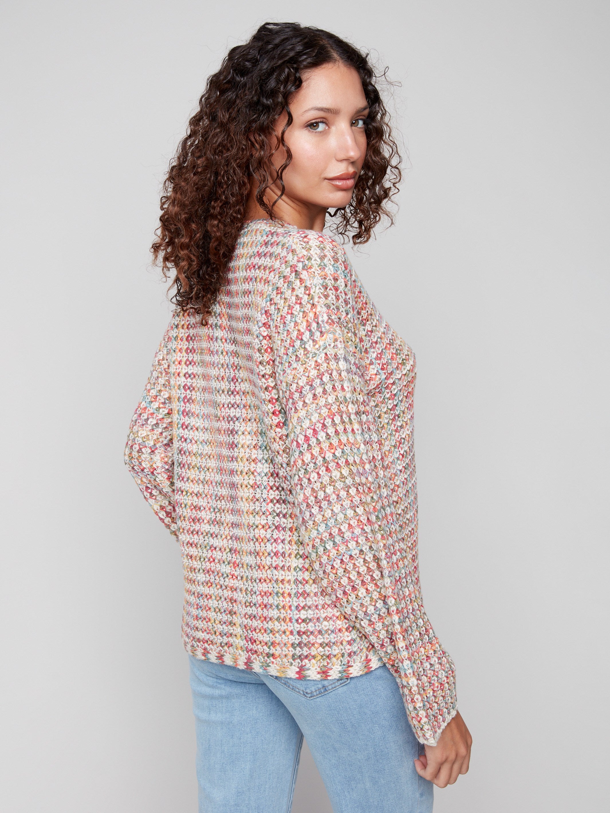 Chic multicolor crochet sweater showcasing a unique drop shoulder design by Charlie B.