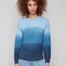 Blue ombre sweater with a classic crew neck, showcasing a smooth gradient pattern and knit cuffs by Charlie B.