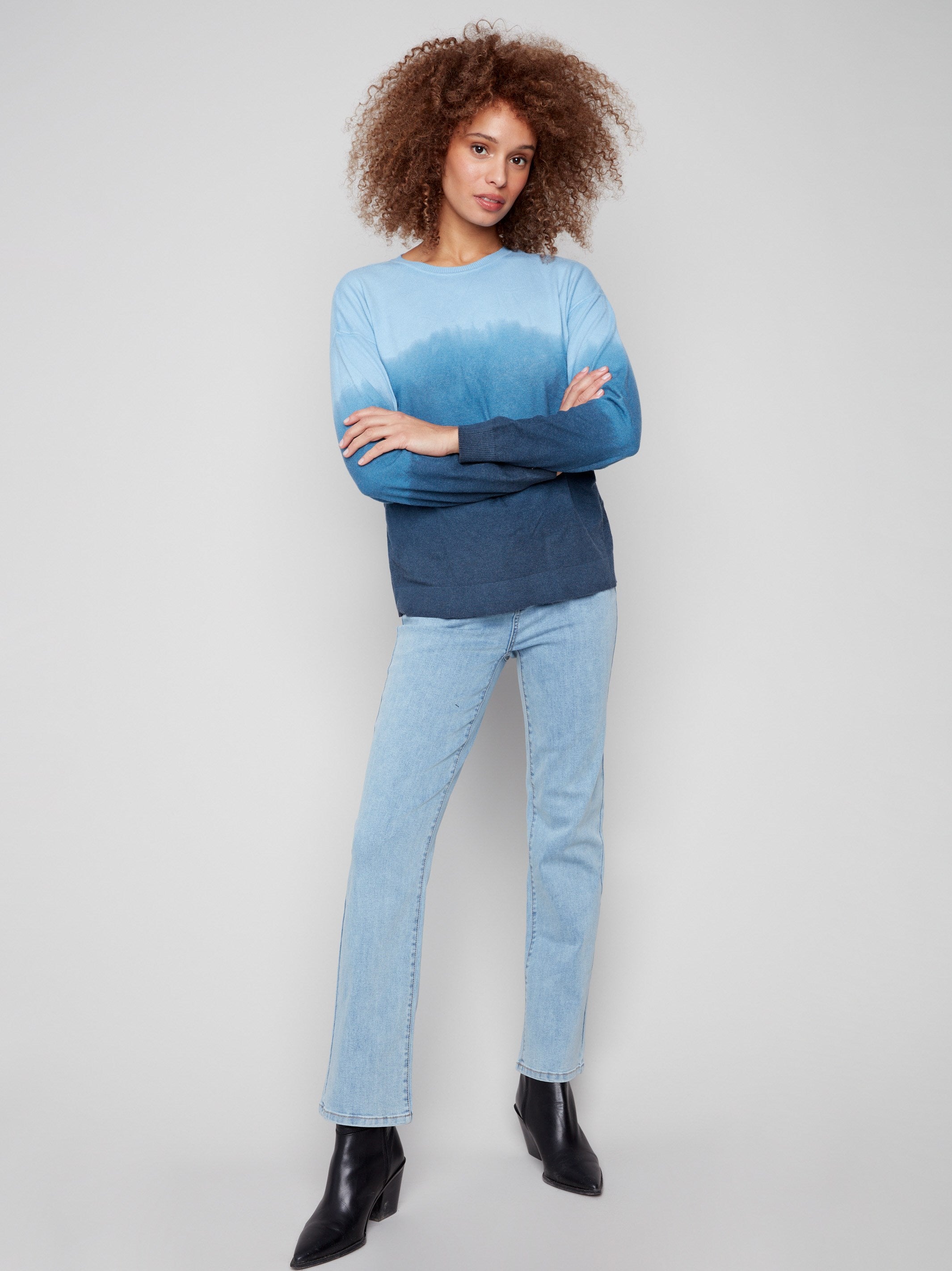 Chic blue ombre sweater highlighting its comfortable crew neck and artistic gradient style, ideal for layering by Charlie B.