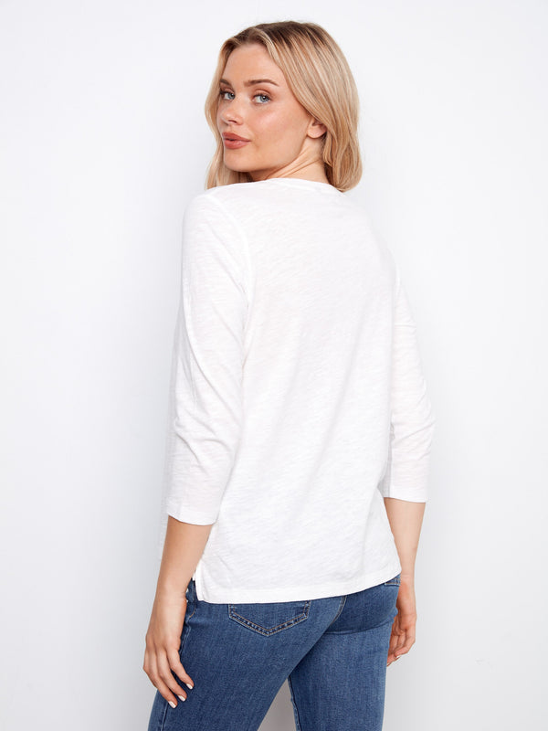 Elegant white top with subtle front seam detail and crew neckline for a timeless look in organic cotton, by Charlie B.