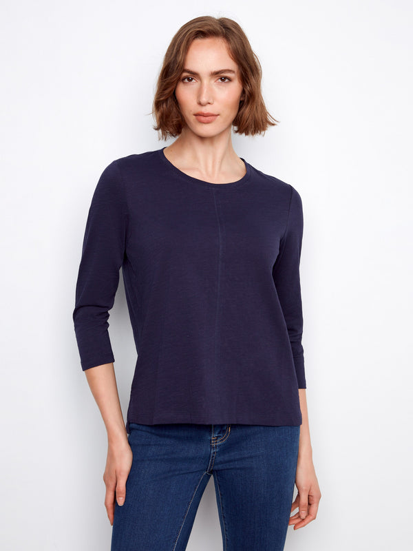 Navy top featuring a crew neckline, perfect for casual outings and layering. The soft fabric ensures comfort all day by Charlie B.
