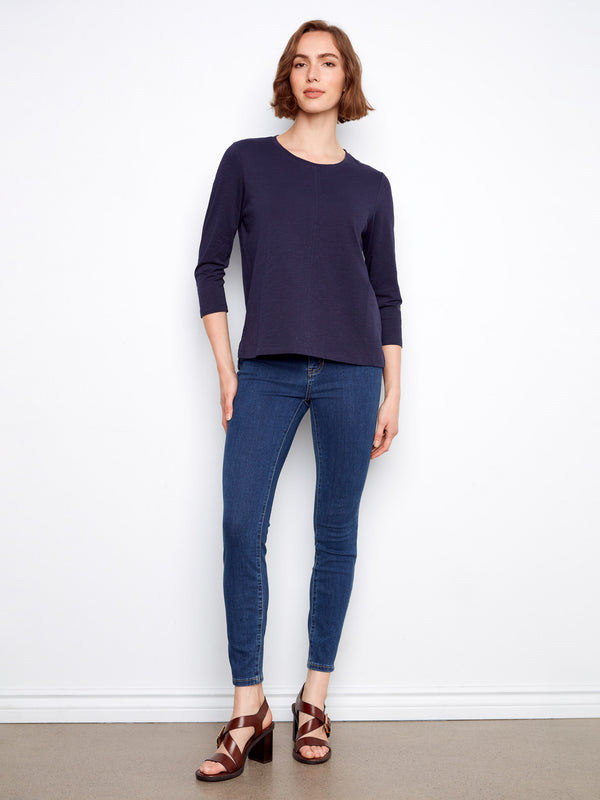 Elegant navy top with front seam detail, adding a touch of sophistication to your everyday style. Ideal for any occasion by Charlie B.