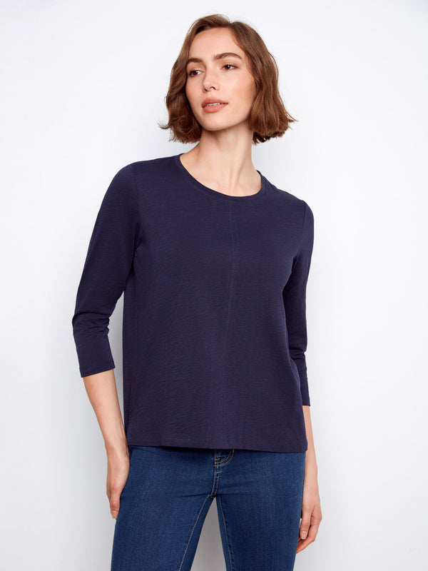Stylish navy top with 3/4 sleeves, offering versatility and comfort for transitional weather. A must-have wardrobe staple by Charlie B.