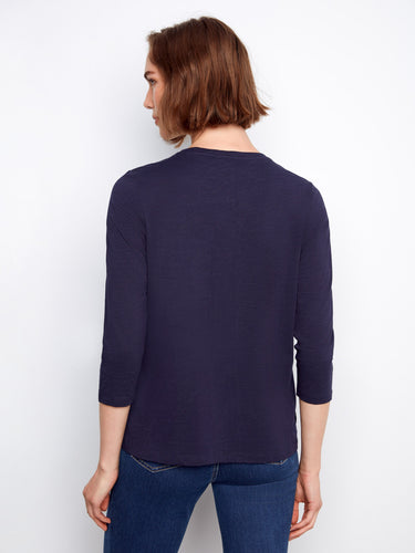 Casual navy top with a slit hem, providing ease of movement and a chic look. Pair it effortlessly with jeans or skirts by Charlie B.