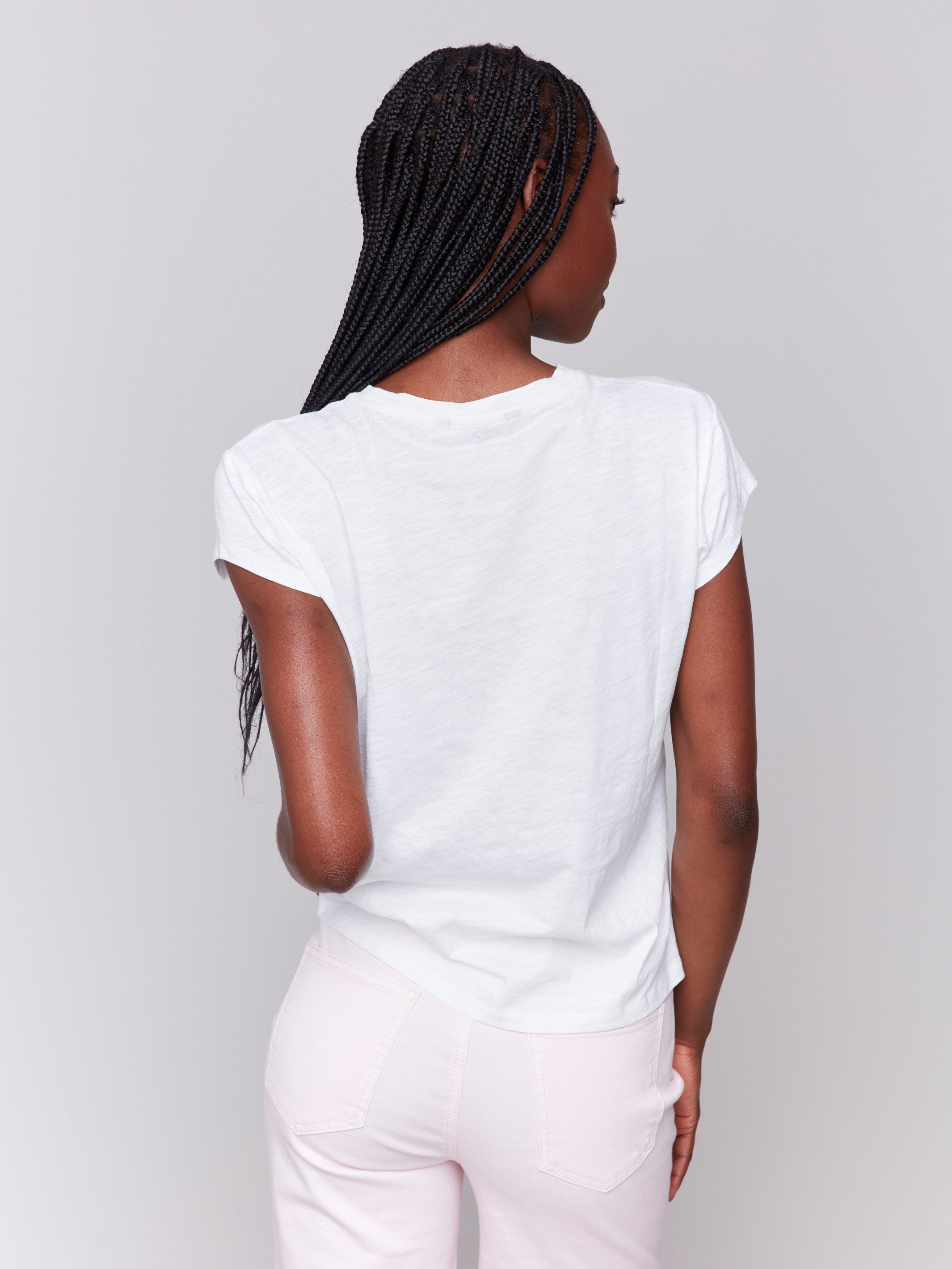 White tee with a front slit detail and crew neckline by Charlie B.