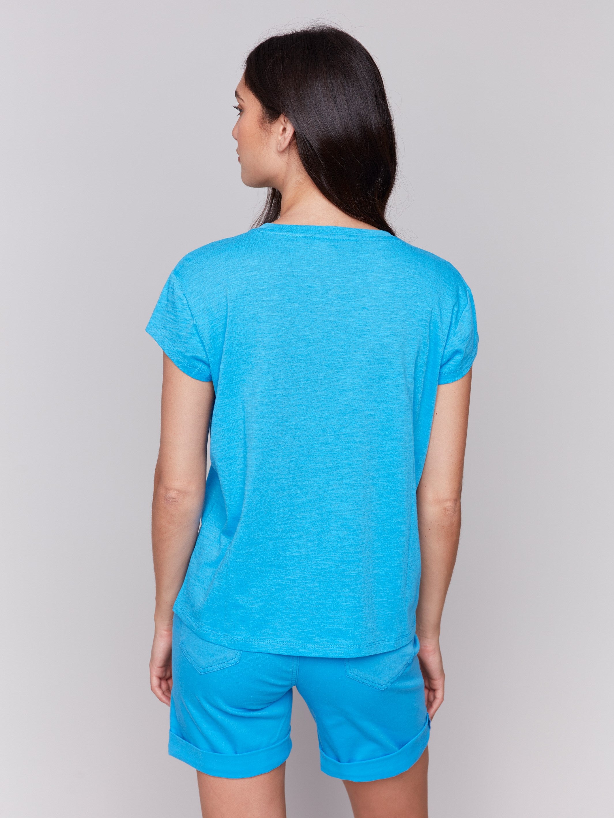 Lagoon tee with a chic chest pocket adds functionality to style by Charlie B.