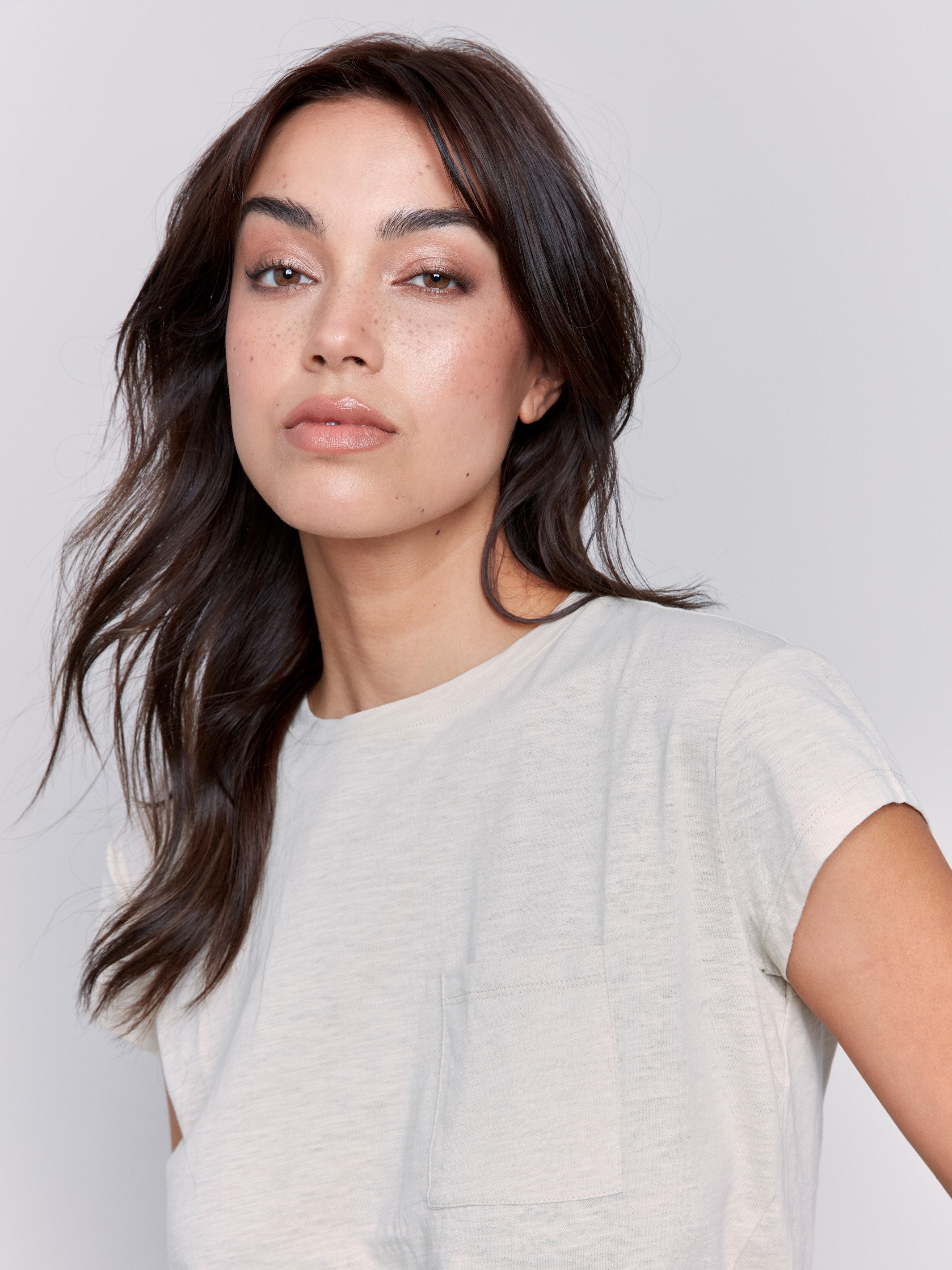 Stylish sand-colored tee featuring a handy chest pocket by Charlie B.