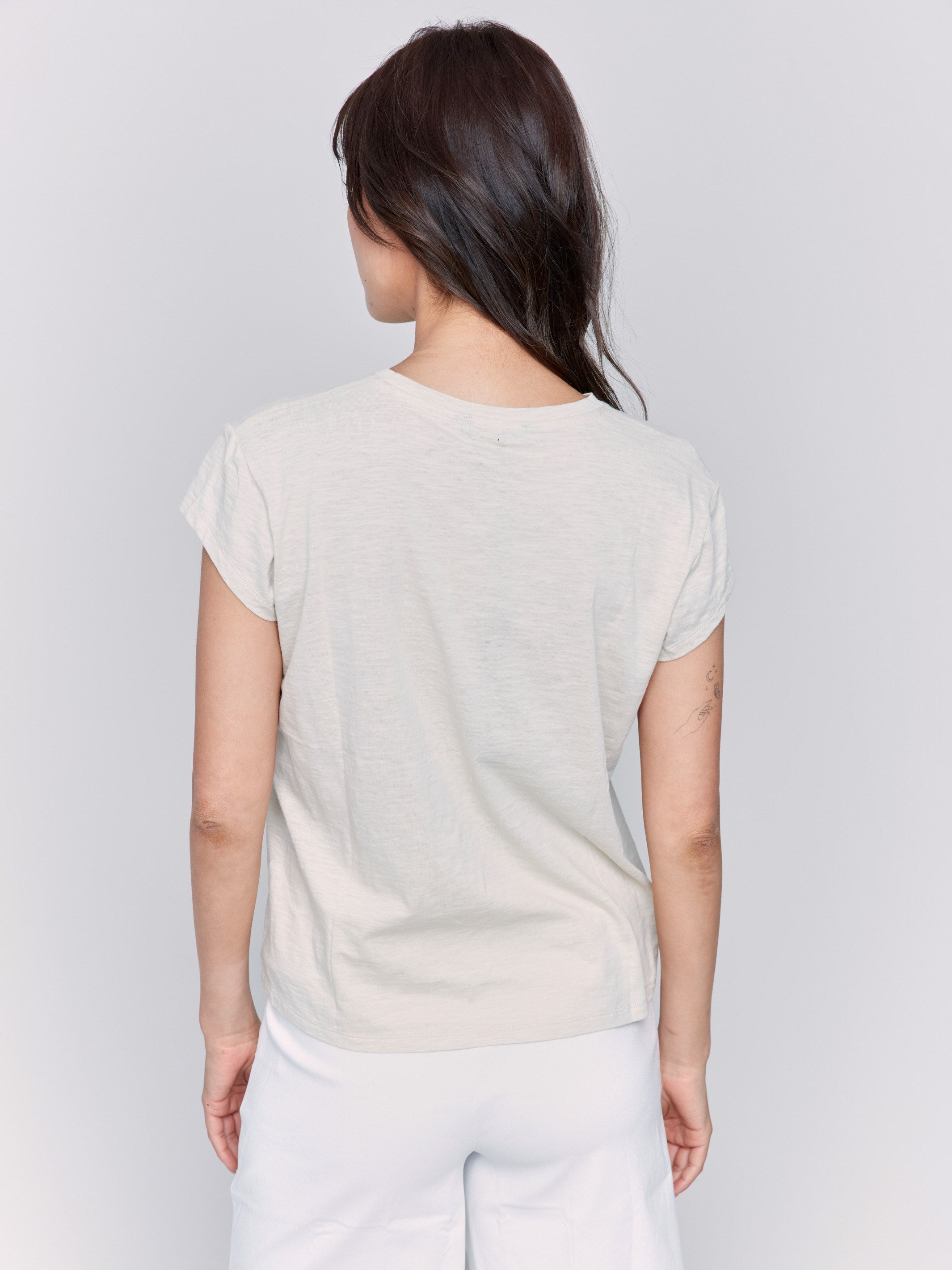 Comfortable sand-colored tee designed with 3/4 sleeves by Charlie B.
