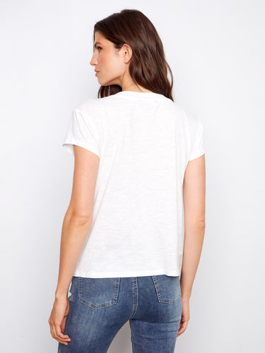 Elevate your wardrobe with this essential white V-neck tee, showcasing a drop shoulder style by Charlie B.