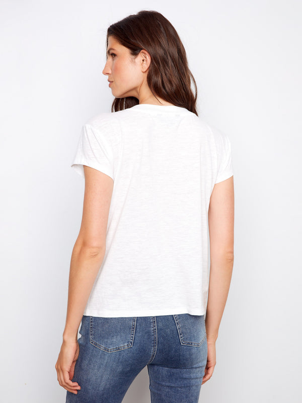 Elevate your wardrobe with this essential white V-neck tee, showcasing a drop shoulder style by Charlie B.