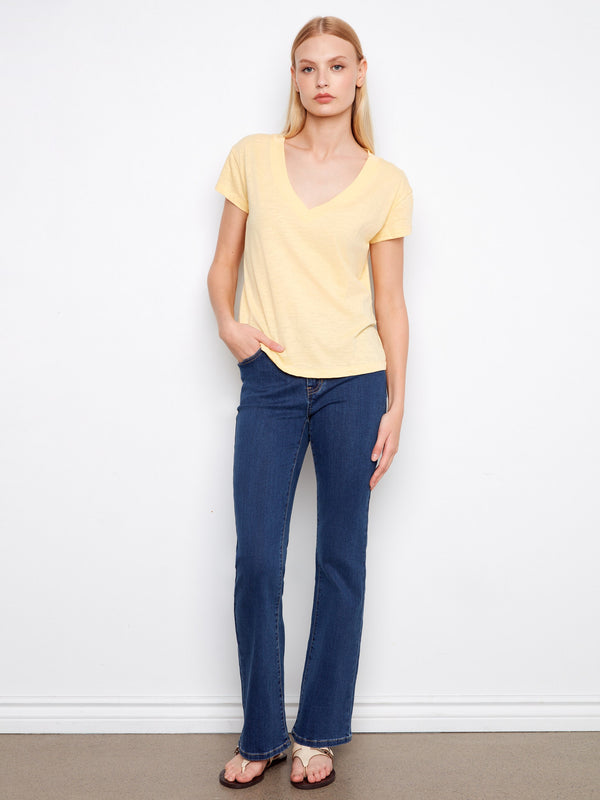 This yellow tee showcases a drop shoulder design, offering a relaxed fit that's both trendy and comfortable. By Charlie B.