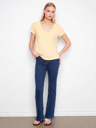 Enjoy the laid-back vibe with this drop shoulder yellow tee, designed for effortless style and ease of movement. By Charlie B.