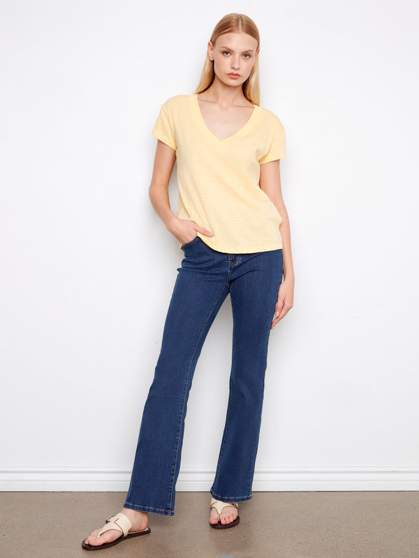 Stay cool in this lightweight cotton yellow T-shirt, offering both comfort and fashion-forward appeal. By Charlie B.