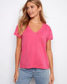 Pink T-shirt featuring a flattering V-neck, perfect for casual outings. Ideal for layering or wearing alone. By Charlie B.