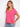 The V-neck on this pink tee adds elegance to its simple design, making it versatile for various occasions. By Charlie B.