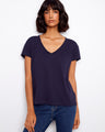 Navy blue top featuring a flattering V-neck, crafted from lightweight cotton for comfort and style. Designed by Charlie B.