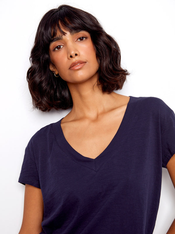 This navy top boasts a drop shoulder design, enhancing its casual elegance. Made from soft cotton by Charlie B.