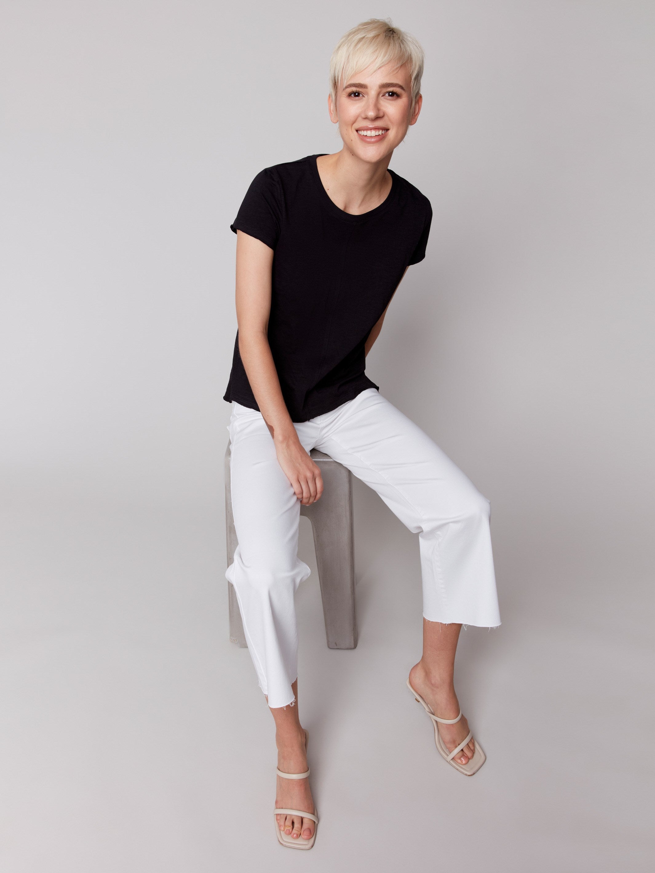 Black organic cotton tee with side slits, by Charlie B.