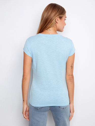 Elegant light blue tee showcasing short sleeves and a simple design perfect for any casual occasion. By Charlie B.