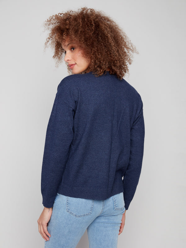 Heather denim sweater offering a relaxed fit with beautiful paisley accents by Charlie B.
