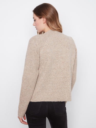 Crafted for comfort and style, the open-front design adds a modern touch to this classic piece. By Charlie B.
