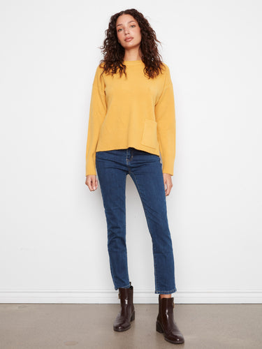 The stylish side slits on this sweater add a modern twist to its classic silhouette. By Charlie B.