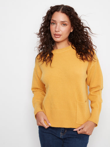 Enjoy the comfort of drop shoulders in this chic yellow sweater with ribbed cuffs. By Charlie B.
