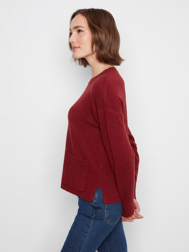Versatile burgundy sweater that combines comfort with trendy design elements like the crew neck and slits. By Charlie B.