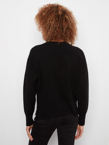 Elegant black sweater showcasing versatile side slits and a cozy feel by Charlie B.
