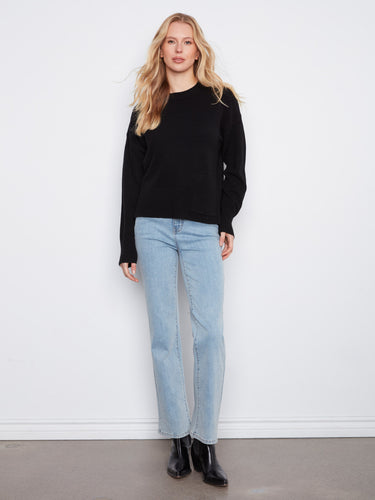 Stylish black crew neck sweater enhanced with fashionable drop shoulders for comfort by Charlie B.