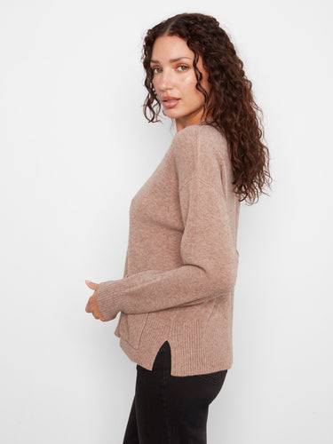 This stylish sweater includes subtle side slits for added comfort and movement, making it a great choice for any occasion. By Charlie B.