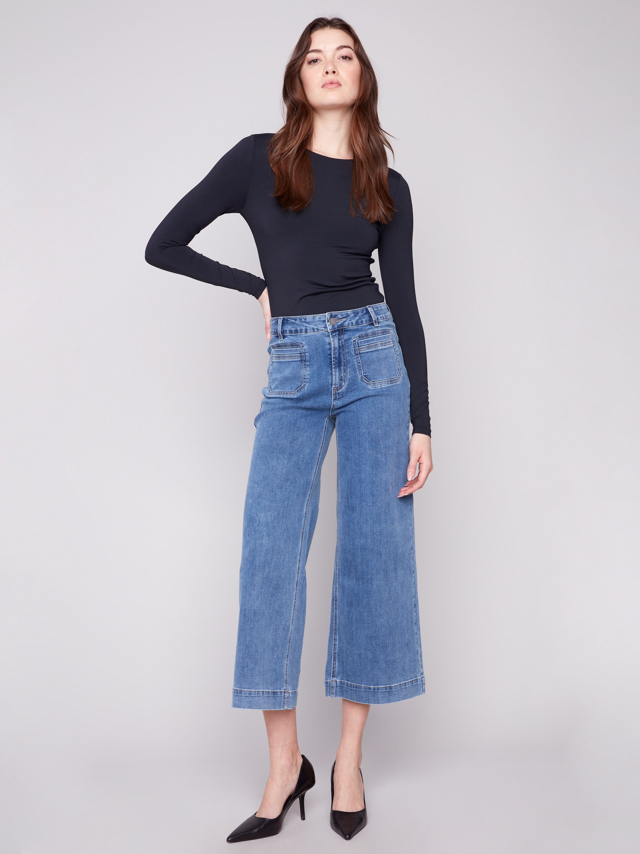 Medium blue jeans with a stylish flare fit, crafted from stretch denim for ultimate comfort by Charlie B.