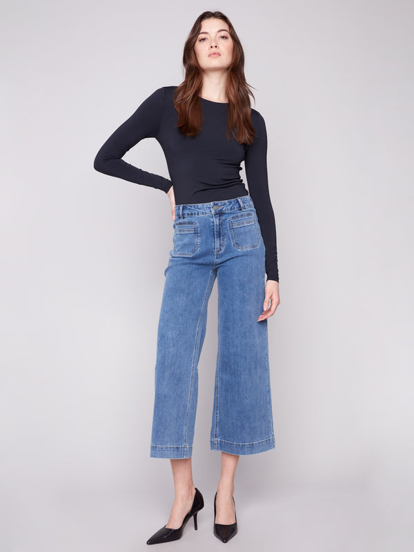 Medium blue jeans with a stylish flare fit, crafted from stretch denim for ultimate comfort by Charlie B.