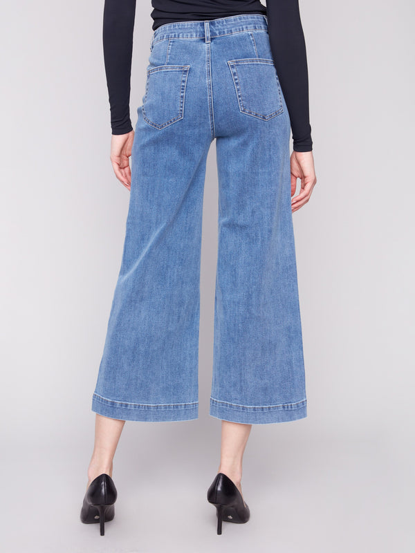 Designed with stretch denim fabric, these medium blue jeans provide flexibility and ease of movement by Charlie B.