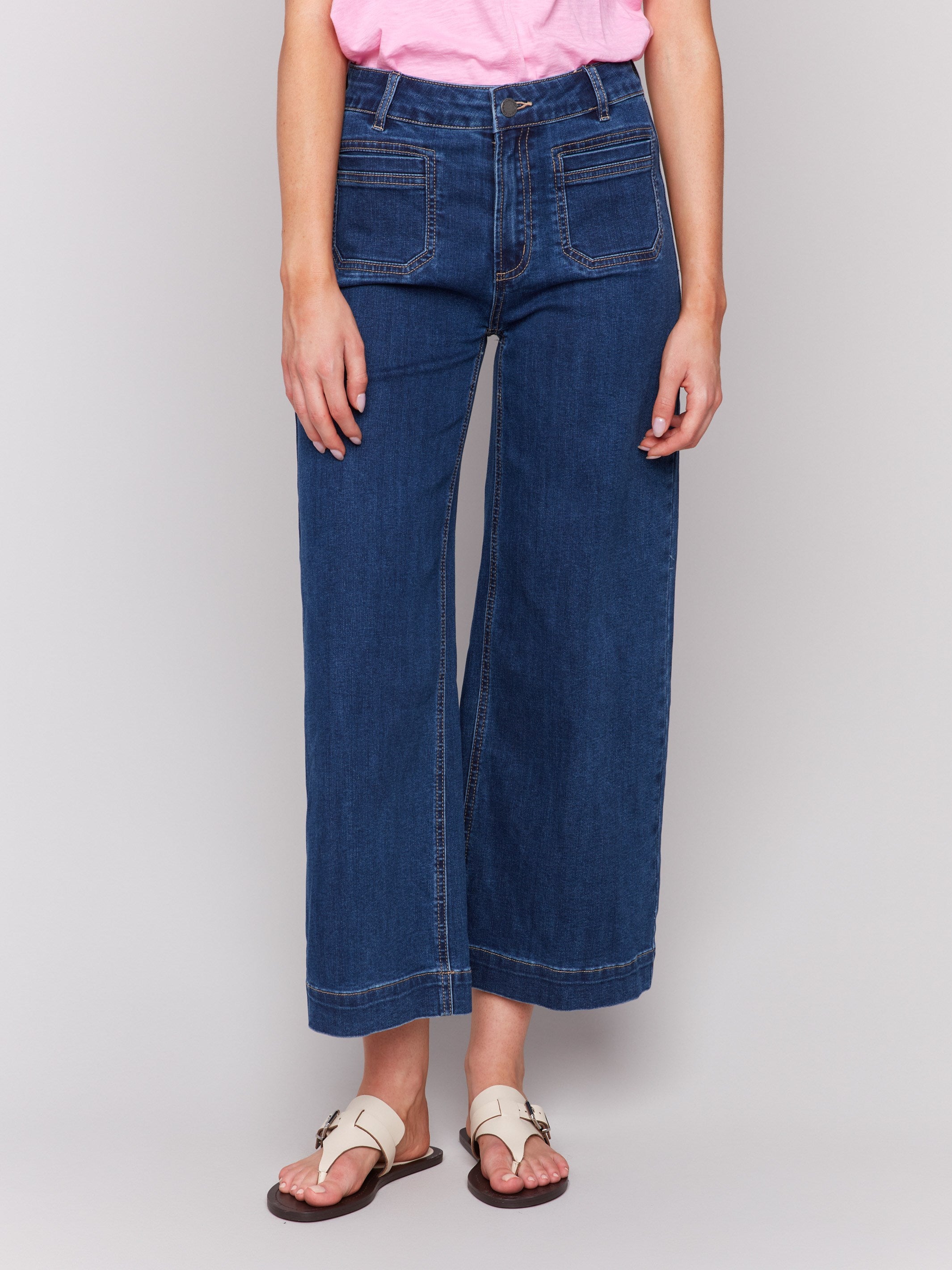 Indigo blue denim flare jeans with front patch pockets and regular rise by Charlie B.