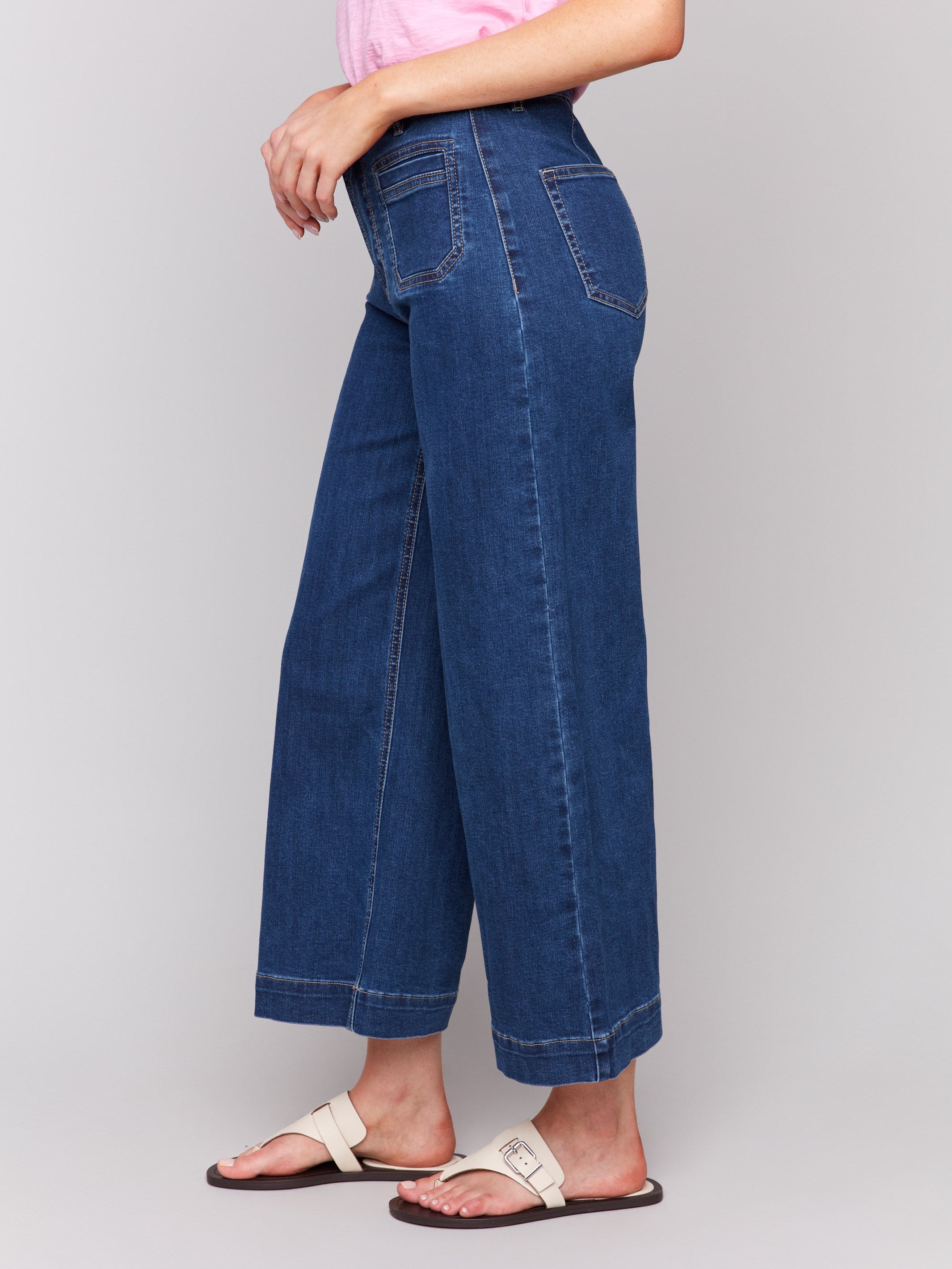 Indigo blue denim flare jeans with front patch pockets and regular rise by Charlie B.